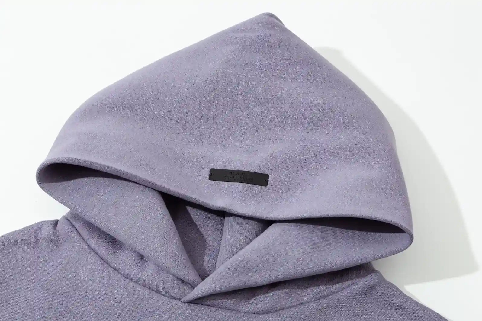 essentials pastel purple hoodie front view minimalist design