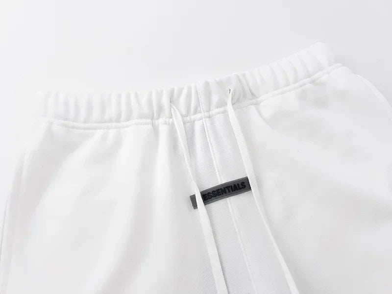 Fear of God Essentials eggshell fleece shorts with tonal logo and relaxed fit