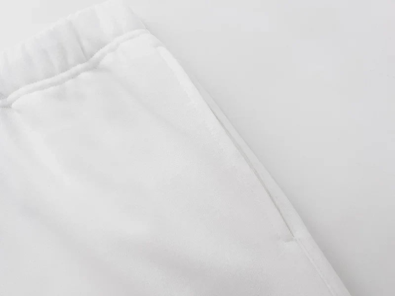 Fear of God Essentials eggshell fleece shorts with tonal logo and relaxed fit