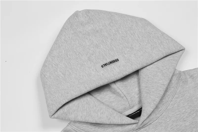 essentials gray hoodie front view minimalist design