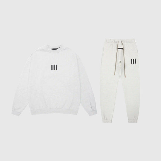 Essentials Cloud Dance core fleece tracksuit front view by Fear Of God