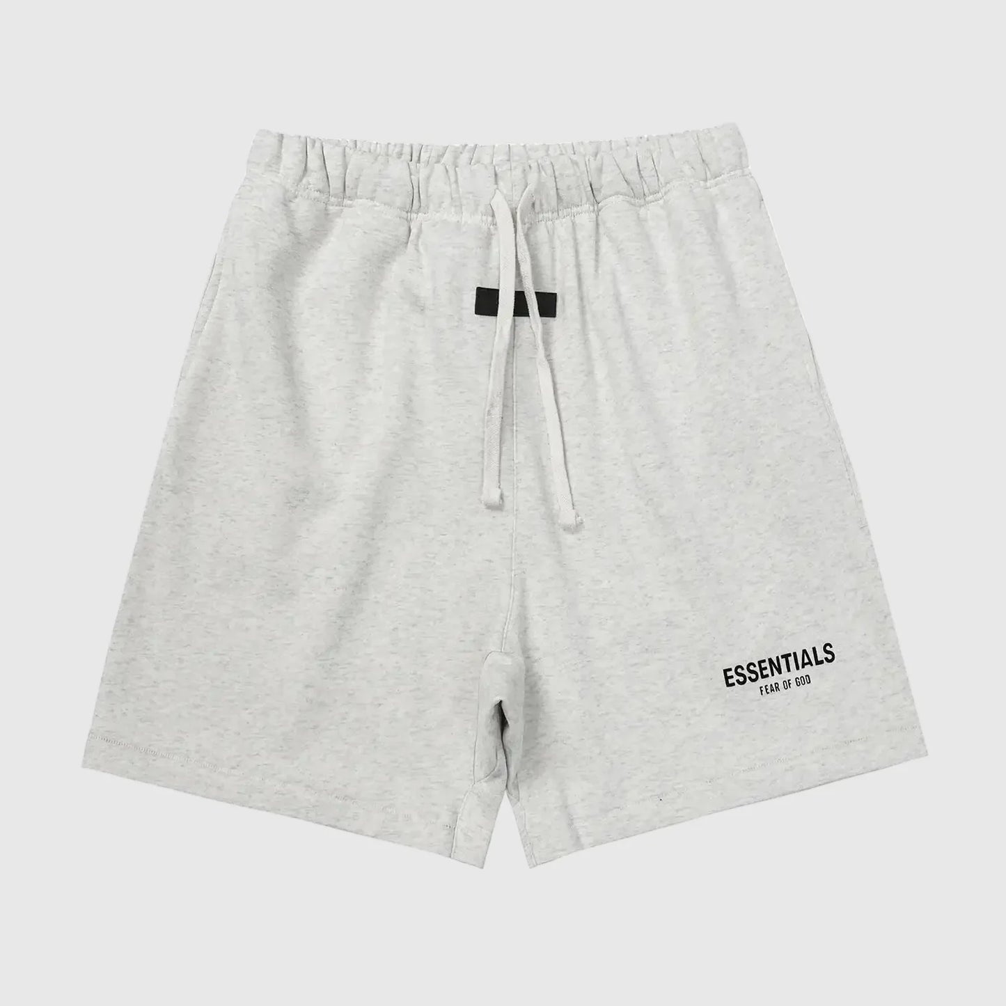 Fear of God Essentials light heather oatmeal fleece shorts with tonal branding and relaxed silhouette