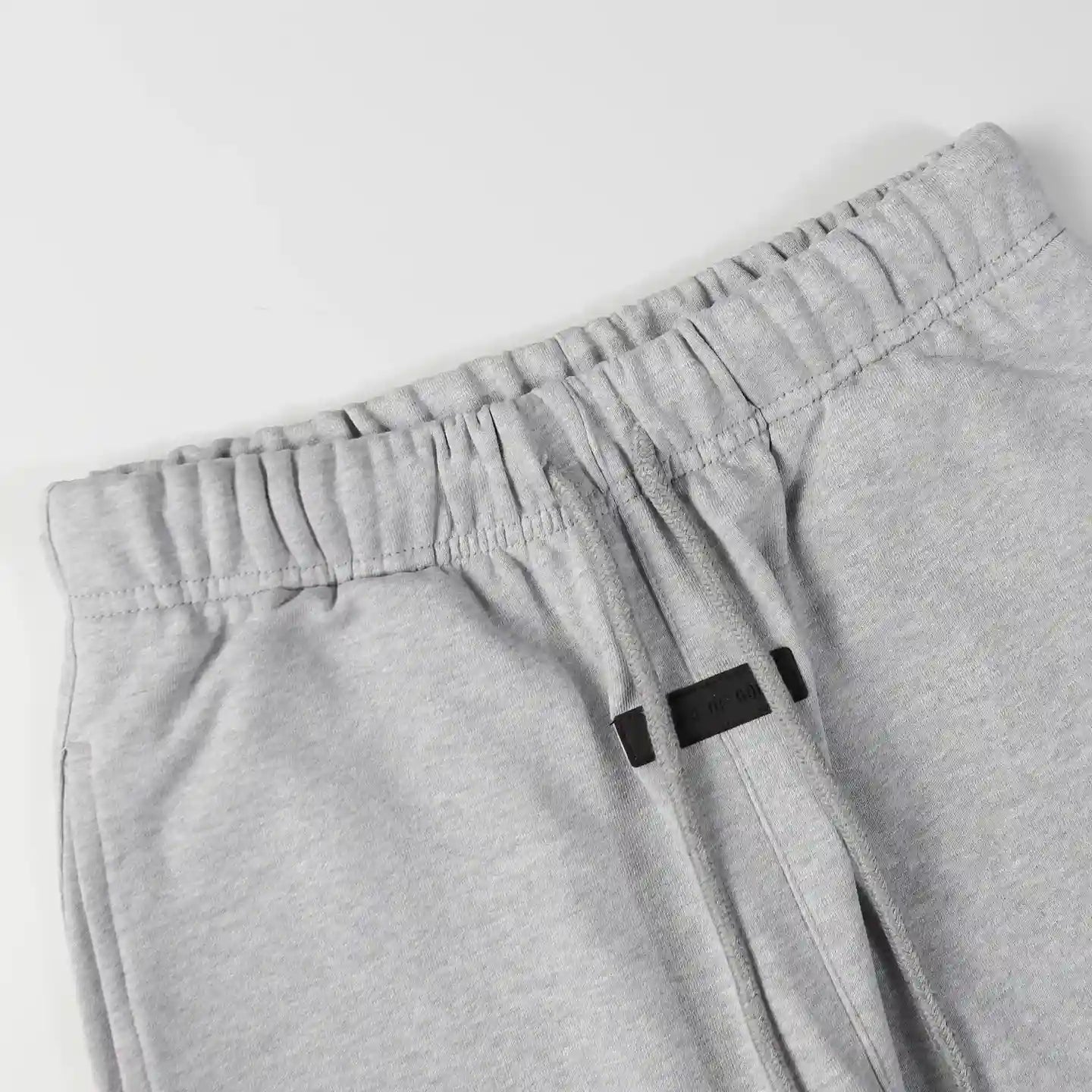 Premium fleece fabric detail on dark heather oatmeal sweatpants by Fear of God