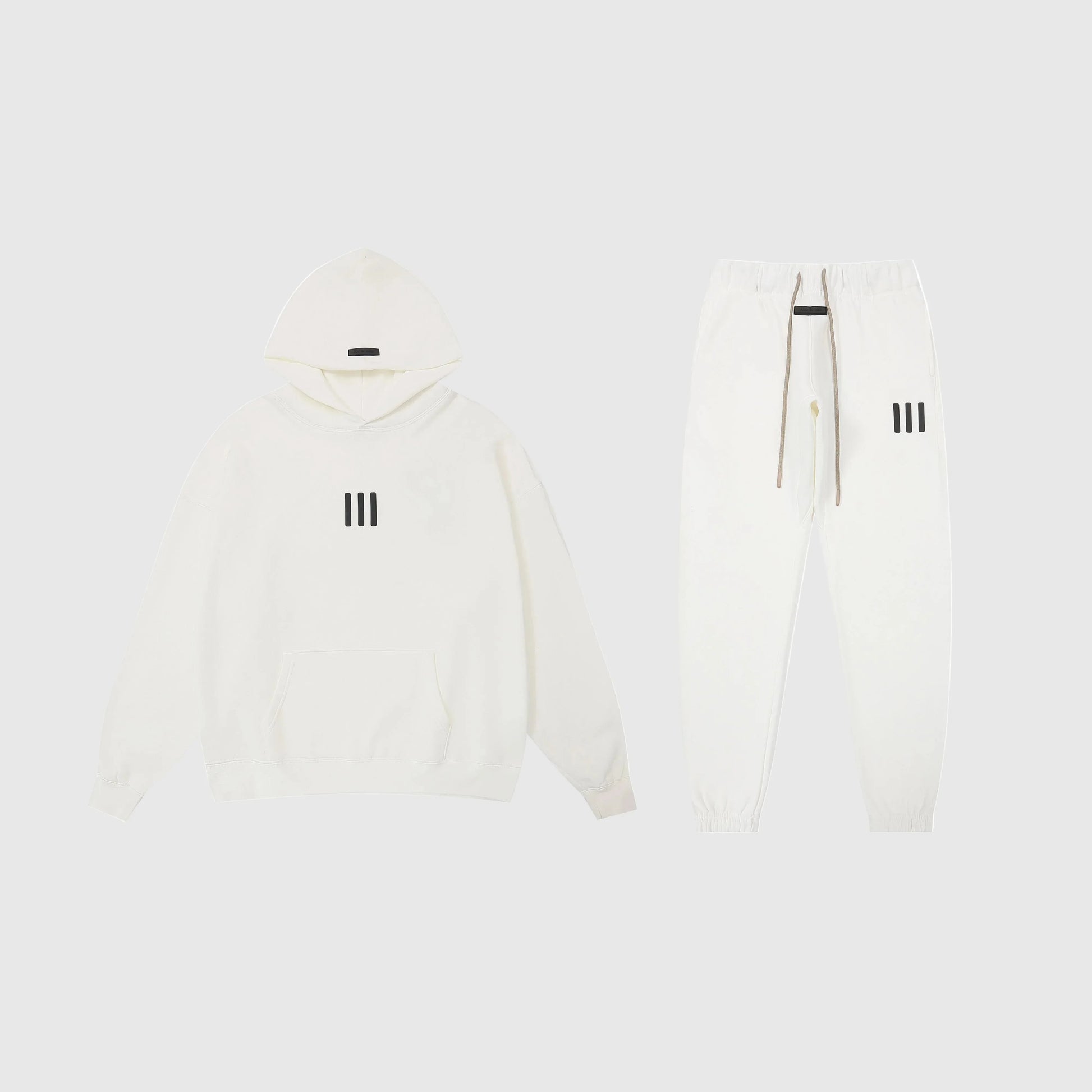 Fear of God Essentials eggshell tracksuit front view hoodie and joggers