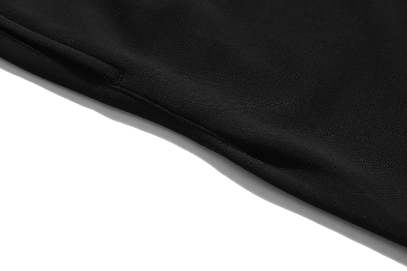 Fear of God Essentials black fleece shorts with tonal branding and relaxed streetwear fit