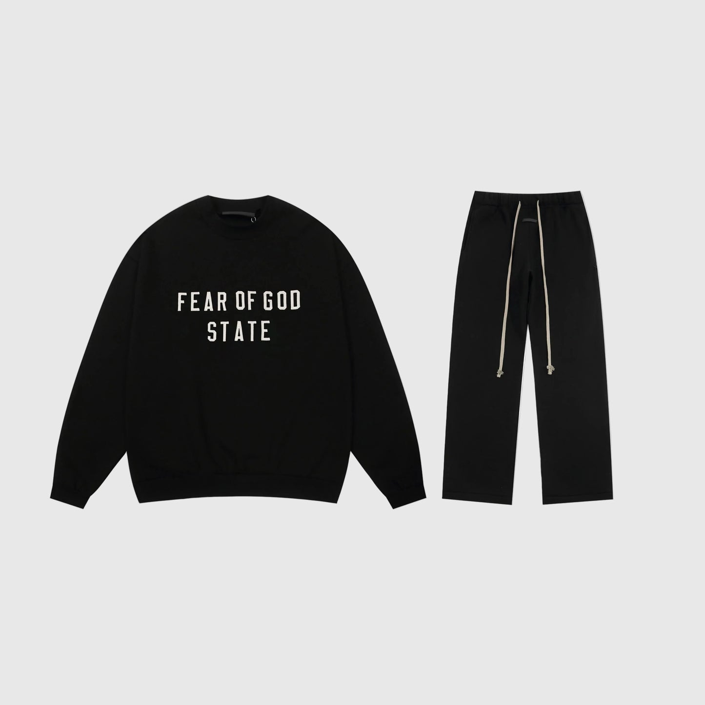 Essentials black minimal fleece tracksuit set with relaxed fit by Fear Of God