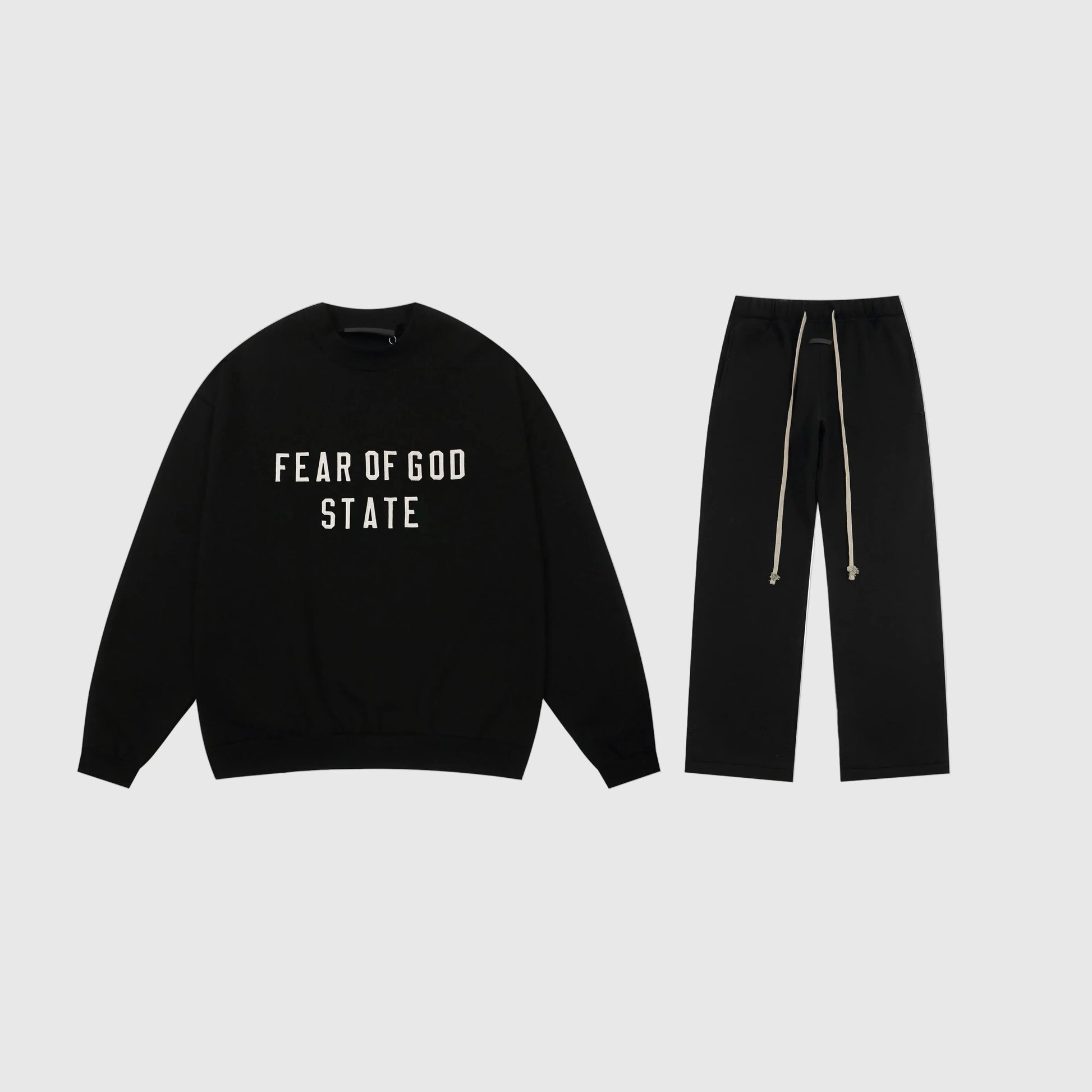 Essentials black minimal fleece tracksuit set with relaxed fit by Fear Of God
