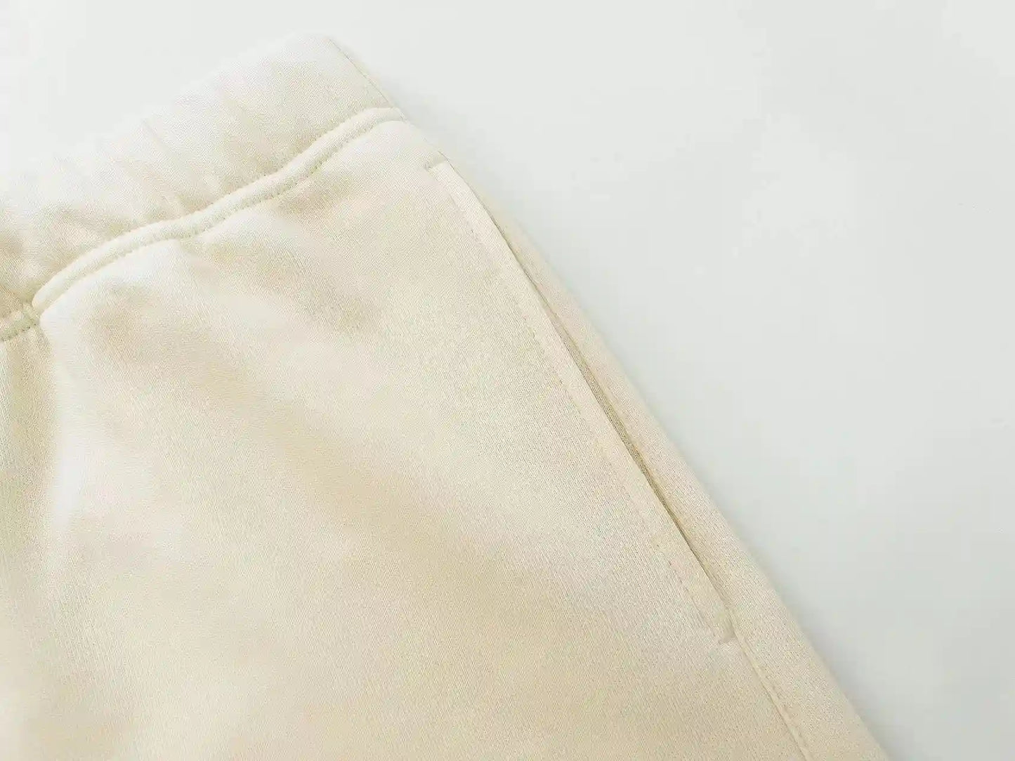 Fear of God Essentials Cloud Dance fleece shorts in off-white with tonal branding and relaxed fit