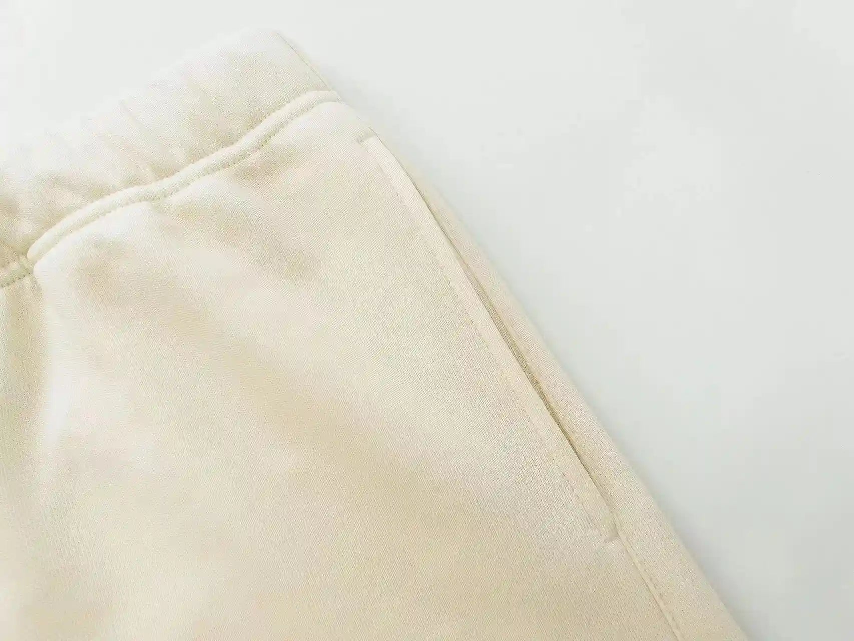 Fear of God Essentials Cloud Dance fleece shorts in off-white with tonal branding and relaxed fit