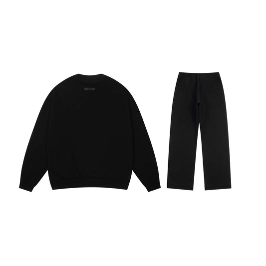 Essentials black minimal fleece hoodie with soft interior detail by Fear Of God