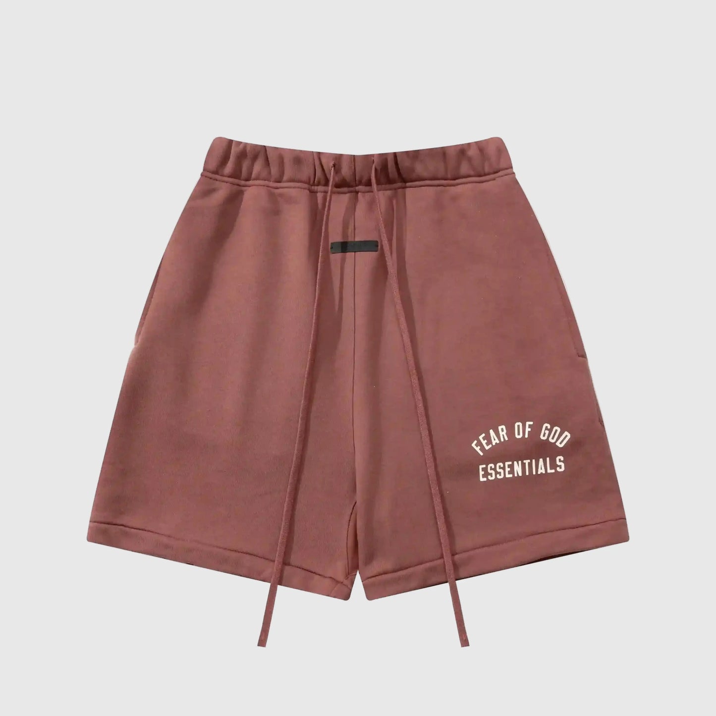 Fear of God Essentials Dark Chestnut fleece shorts with tonal logo and relaxed streetwear silhouette