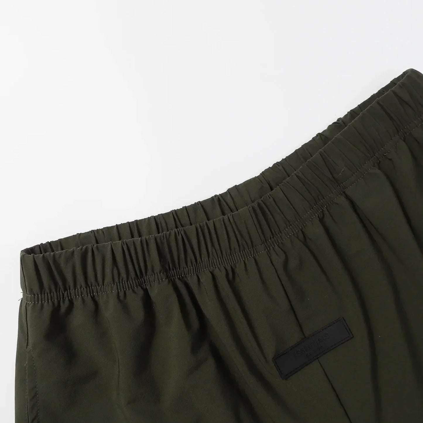 Fear of God Essentials Hemlock green fleece shorts with tonal logo and drawstring waistband