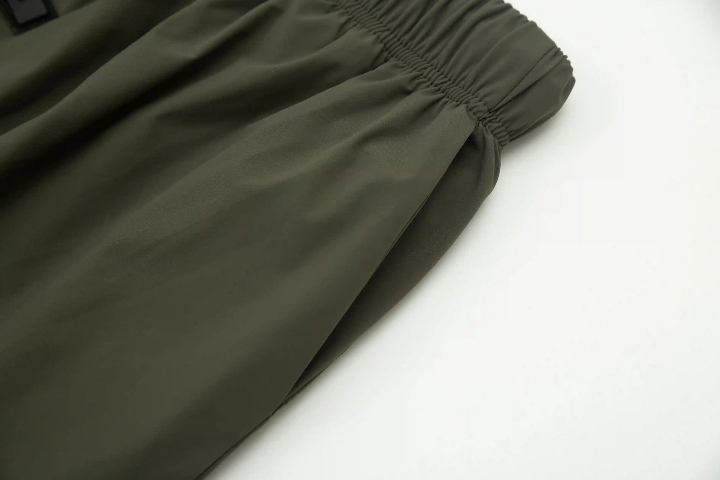 Fear of God Essentials hemlock green fleece shorts with tonal logo and relaxed fit