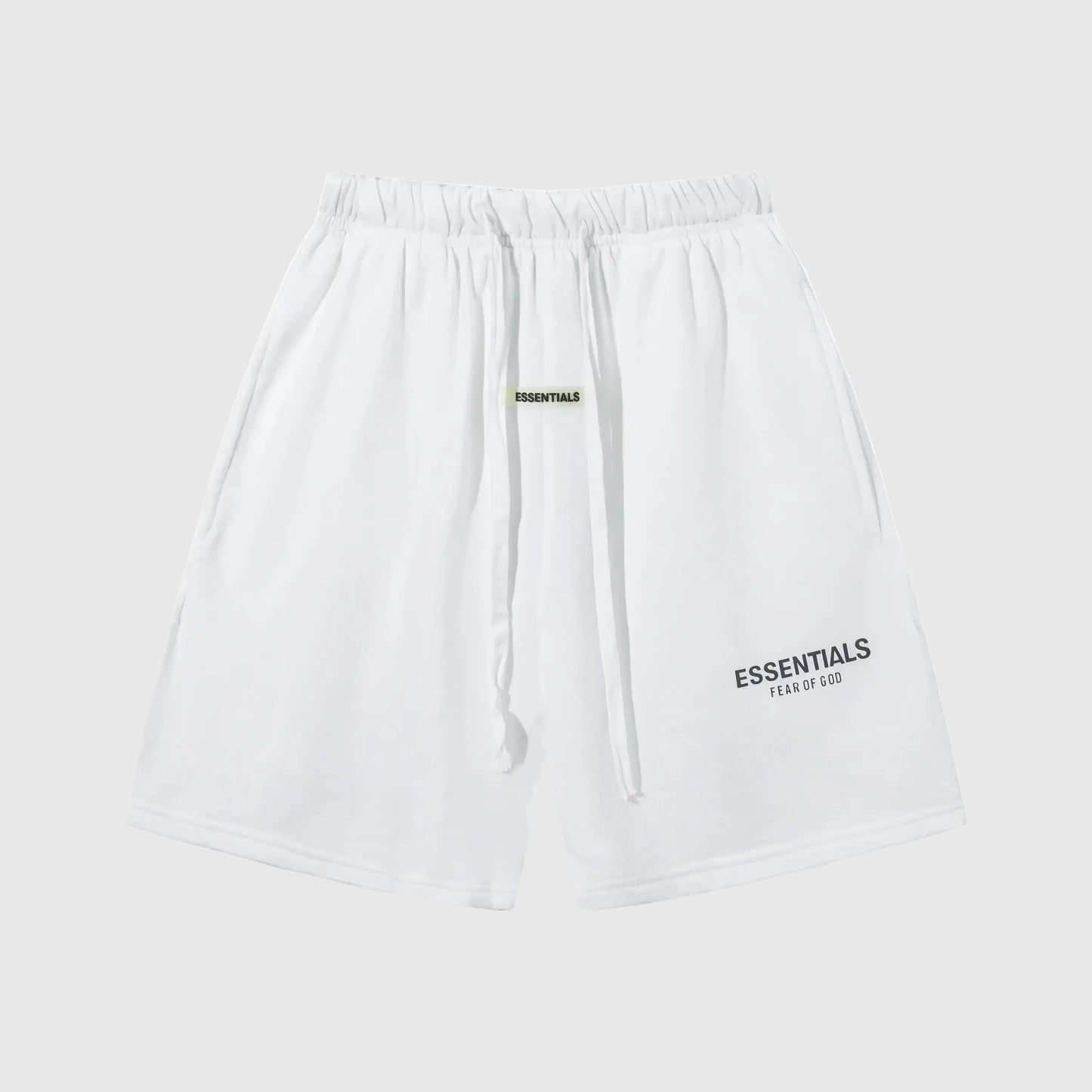 Fear of God Essentials shorts in eggshell neutral fleece with tonal logo and clean fit