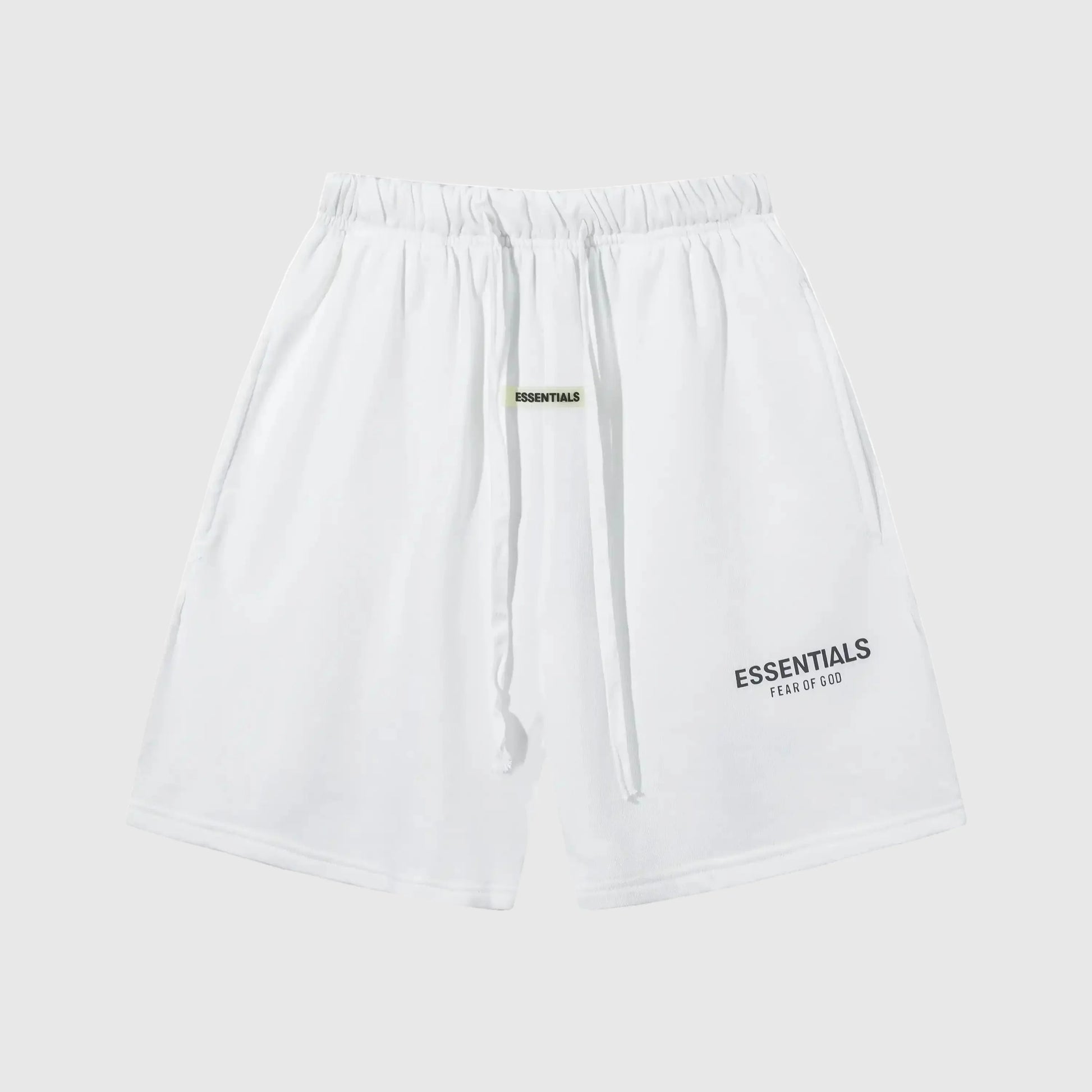 Fear of God Essentials shorts in eggshell neutral fleece with tonal logo and clean fit