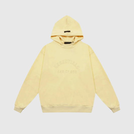 Fear of God Essentials Garden Yellow hoodie front view with rubberized black bar branding