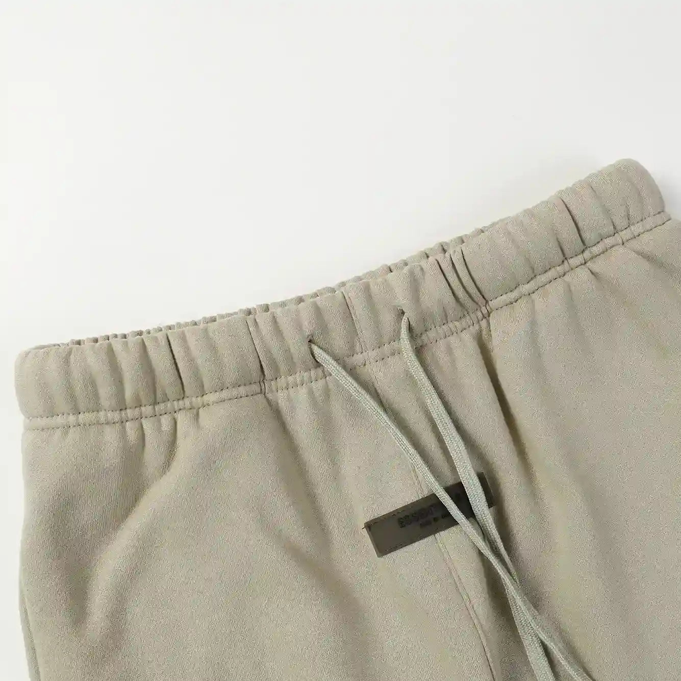 Premium fleece fabric detail on heathered grey sweatpants by Fear of God
