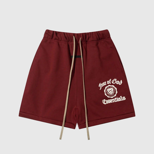 Fear of God Essentials red fleece shorts with tonal branding and relaxed silhouette