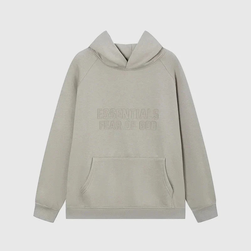 Fear of God Essentials grey hoodie front view with rubberized Black Bar branding