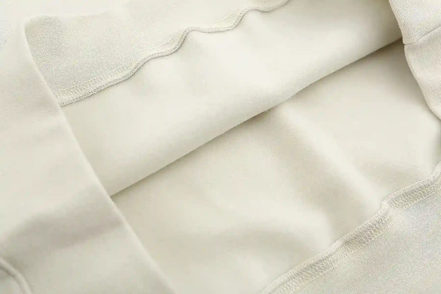 Translucent rubberized Essentials sleeve label close-up
