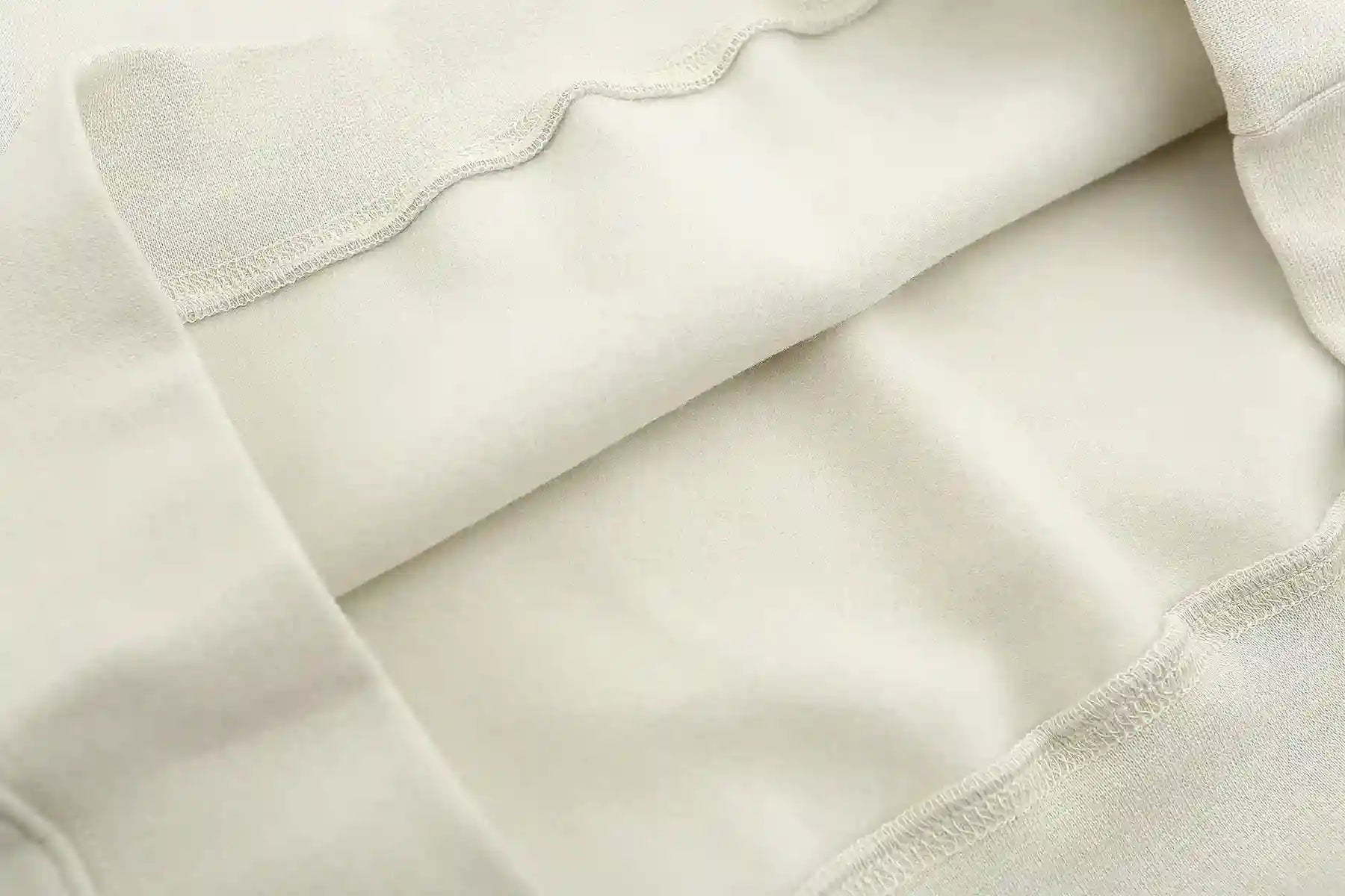 Translucent rubberized Essentials sleeve label close-up
