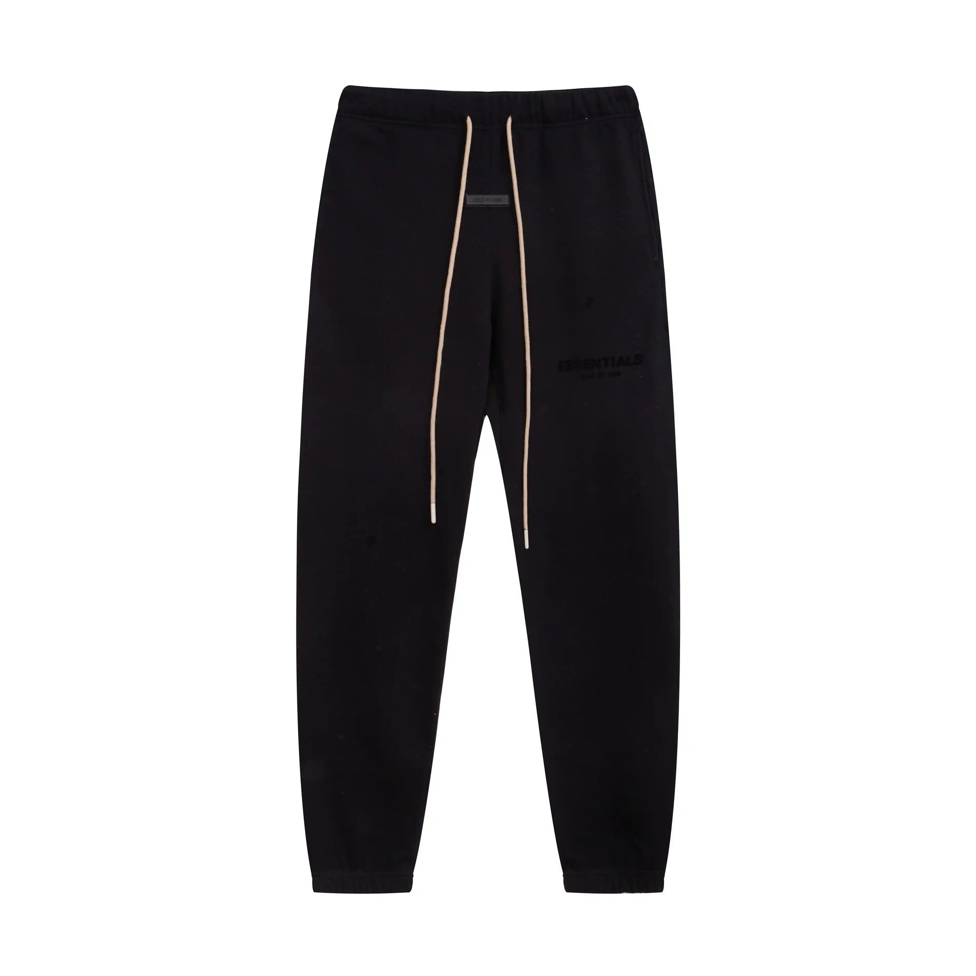 Black Essentials joggers soft-touch rubberized logo on leg close-up