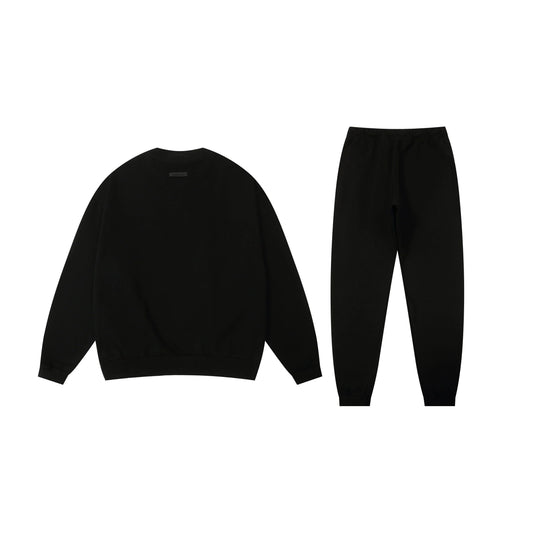 Fear of God essentials black hoodie and tracksuit pants casual outfit
