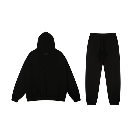 Essentials tracksuit black full set angled view relaxed fit