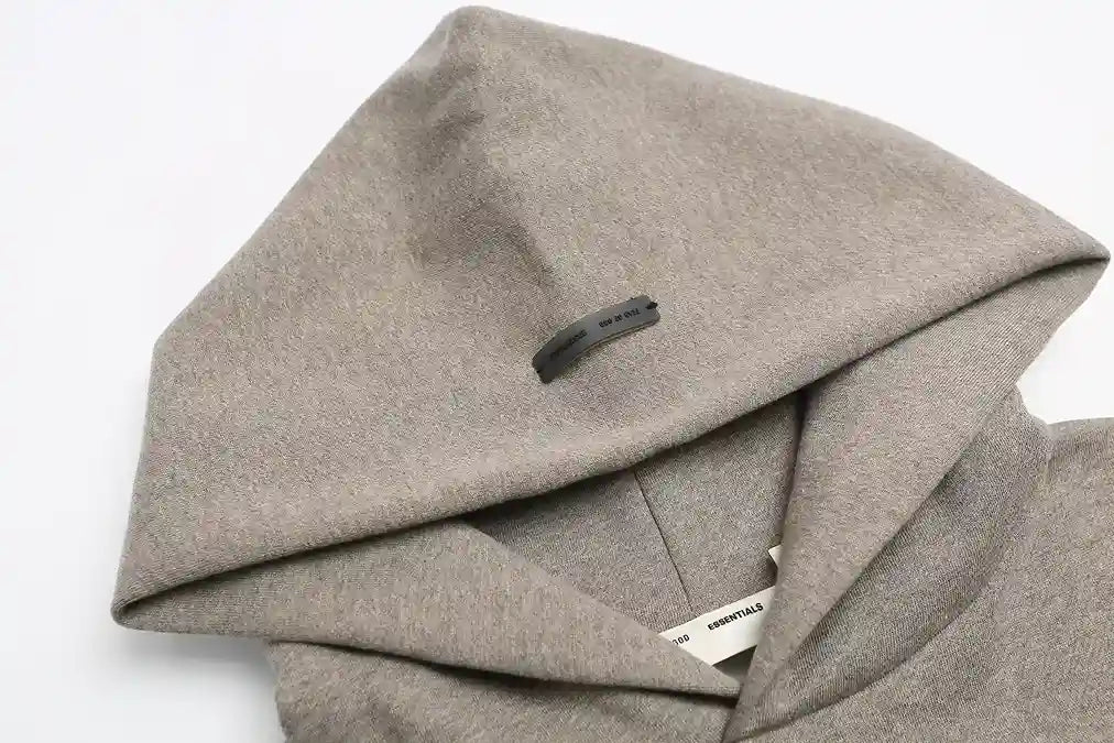 Essentials Dark Heather Oatmeal hoodie branding detail close-up