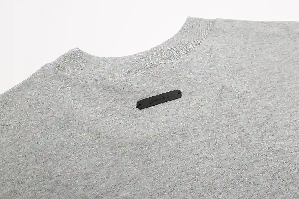 ESSENTIALS Signature 90s Light Grey Tee 