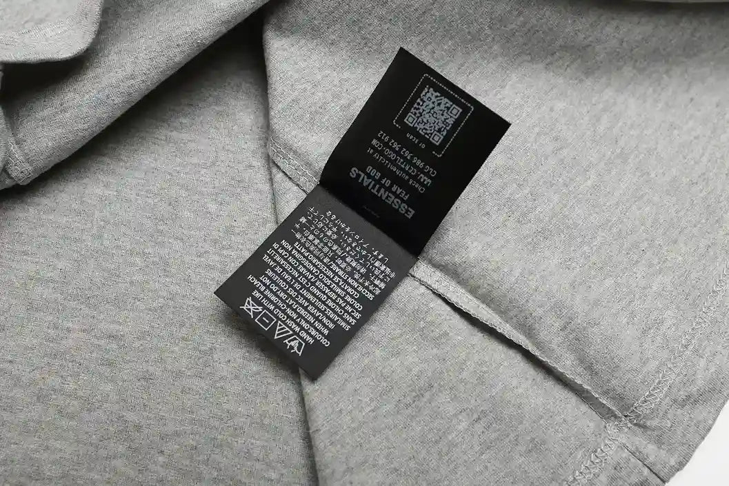 ESSENTIALS Signature 90s Light Grey Tee 