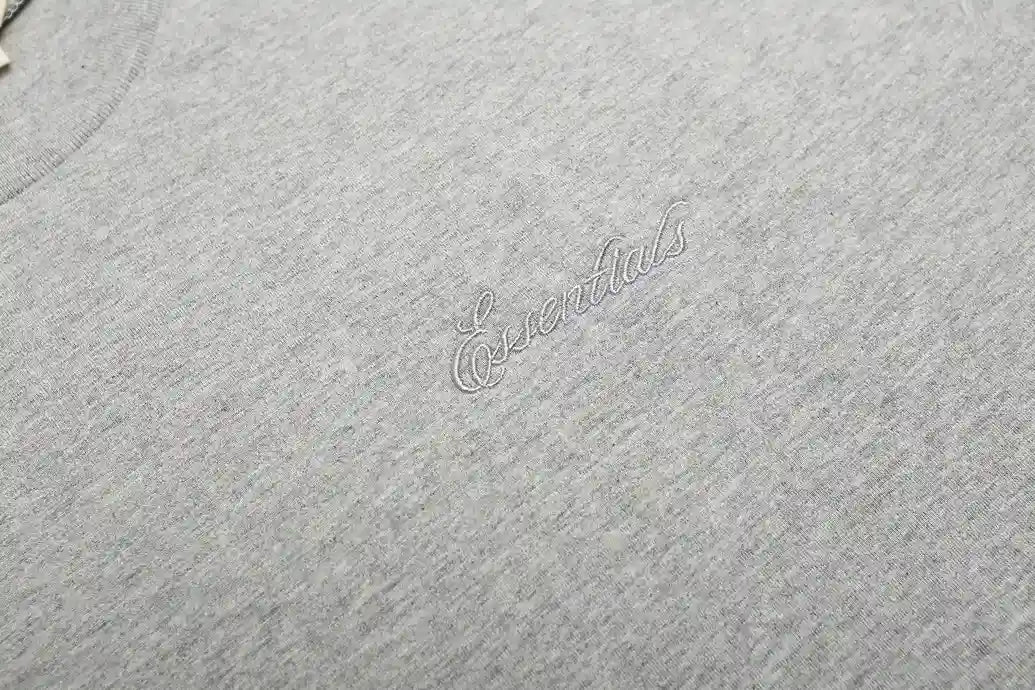 ESSENTIALS Signature 90s Light Grey Tee 