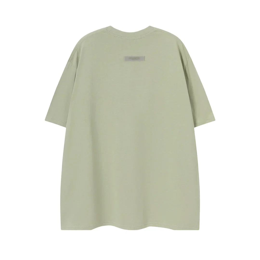 Mint green tee by Fear of God relaxed fit essentials top