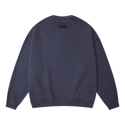 Essentials blue sweatshirt back view beveled metallic logo branding