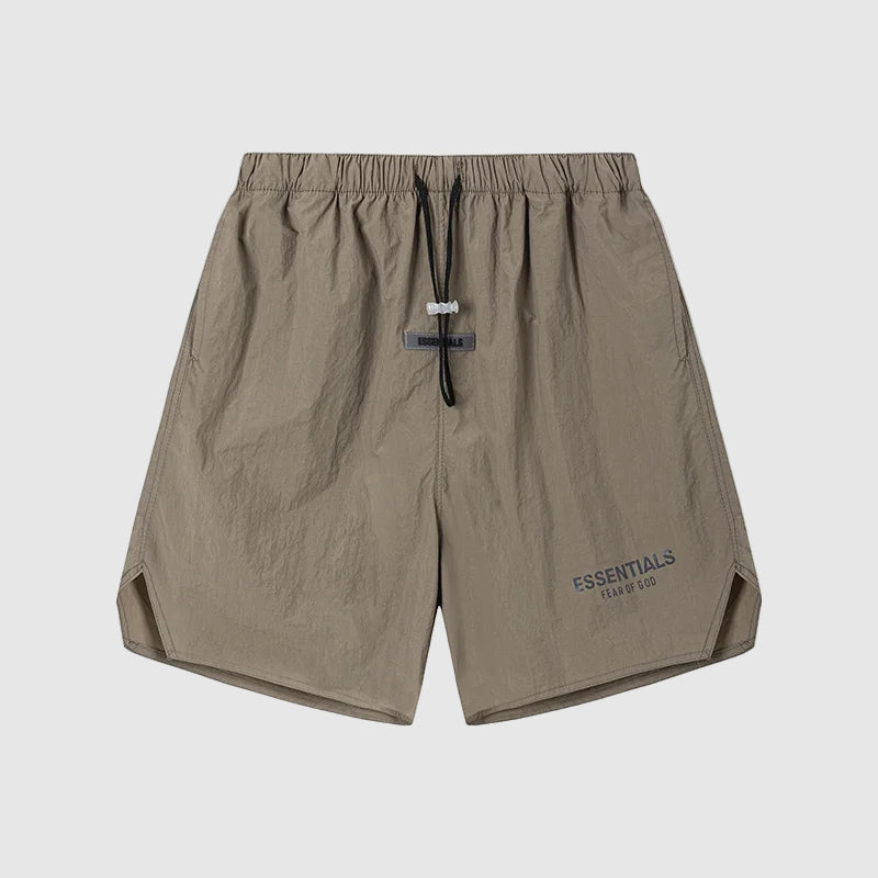 Brown shorts with 'ESSENTIALS' branding on a white background