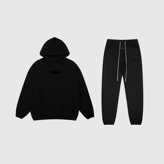 Fear of God Essentials black tracksuit set front view hoodie and joggers