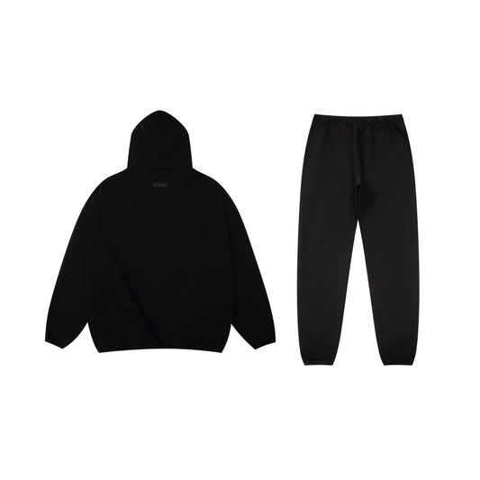 Essentials tracksuit black full set angled view relaxed fit
