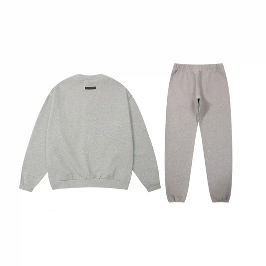 Essentials tracksuit dark heather oatmeal angled view relaxed fit crewneck set