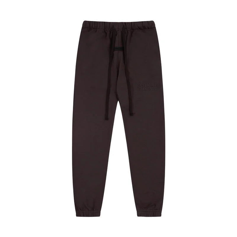 English walnut Essentials joggers soft-touch rubberized logo on leg close-up