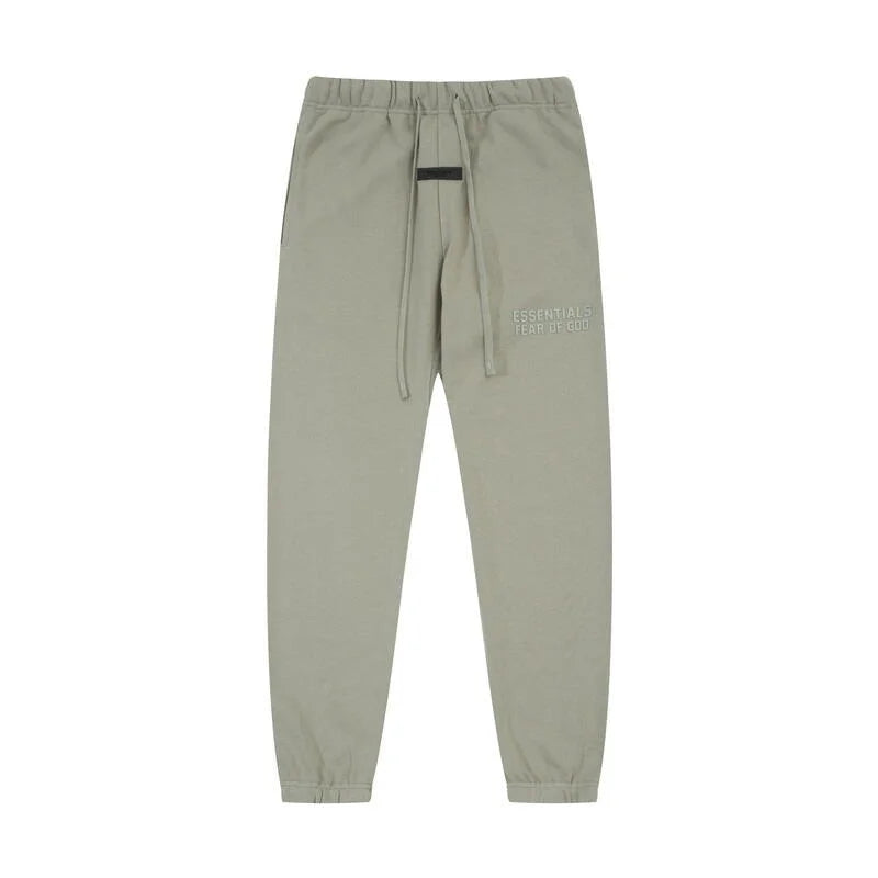 Heathered grey Essentials joggers soft-touch rubberized logo on leg close-up