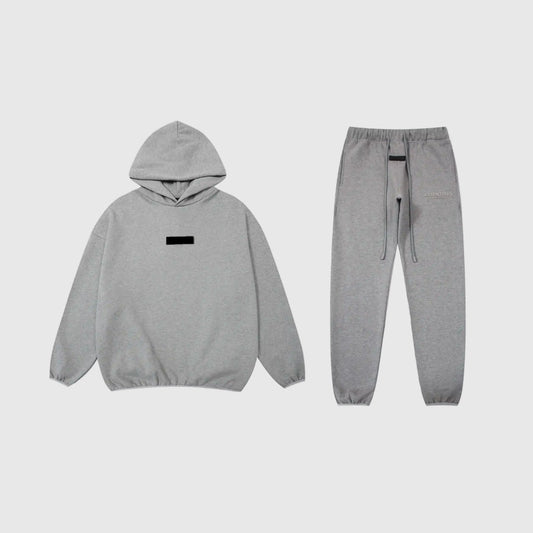 Fear of God Essentials dark heather oatmeal tracksuit front view hoodie and joggers