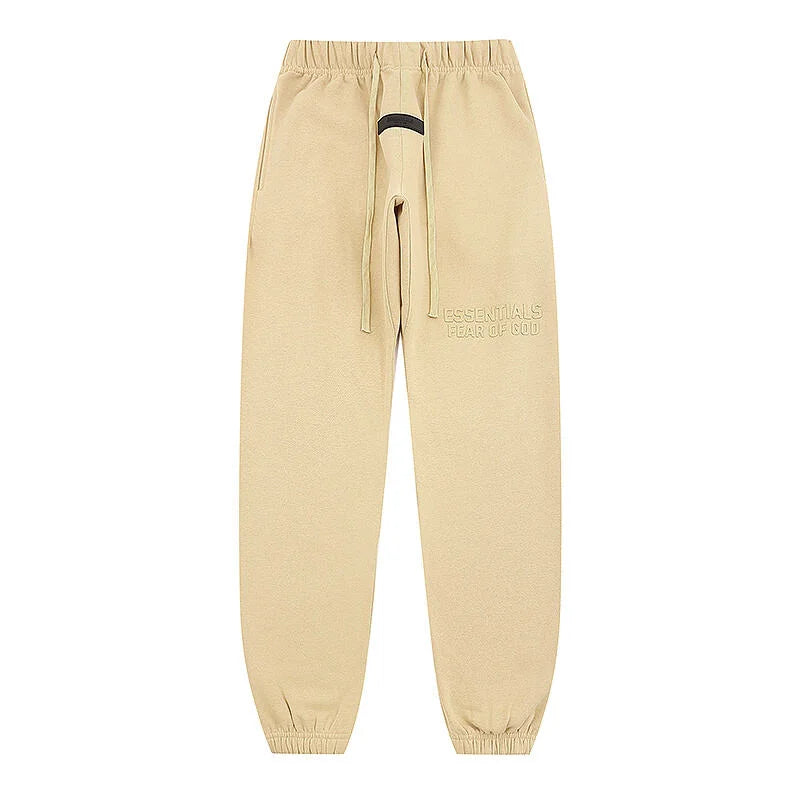Back view of Essentials beige relaxed core fleece tracksuit set by Fear Of God