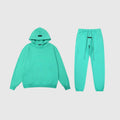 Essentials aqua green comfort fleece tracksuit with relaxed fit by Fear Of God