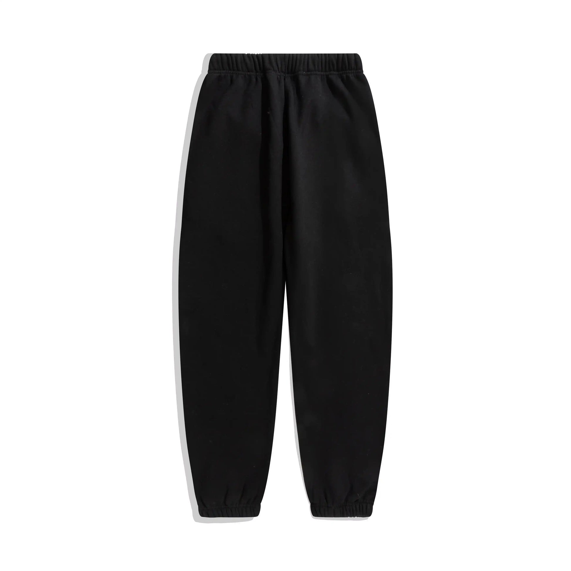 Essentials rubberized label detail on black tracksuit (hood or front label)