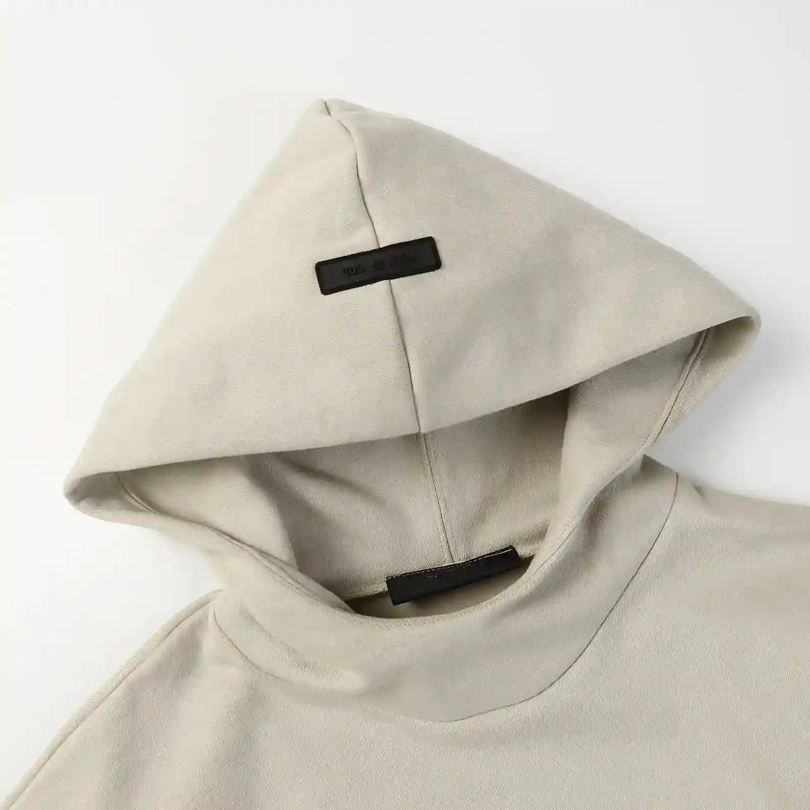 Heathered grey Essentials hoodie side seam pocket detail