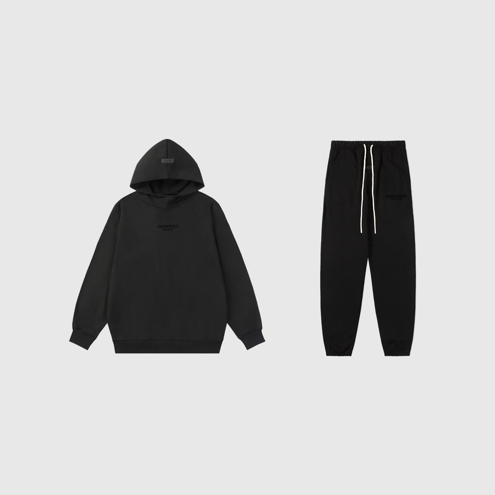 Fear of God Essentials black tracksuit set front view hoodie and joggers