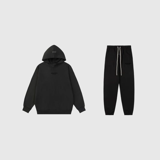 Fear of God Essentials black tracksuit set front view hoodie and joggers