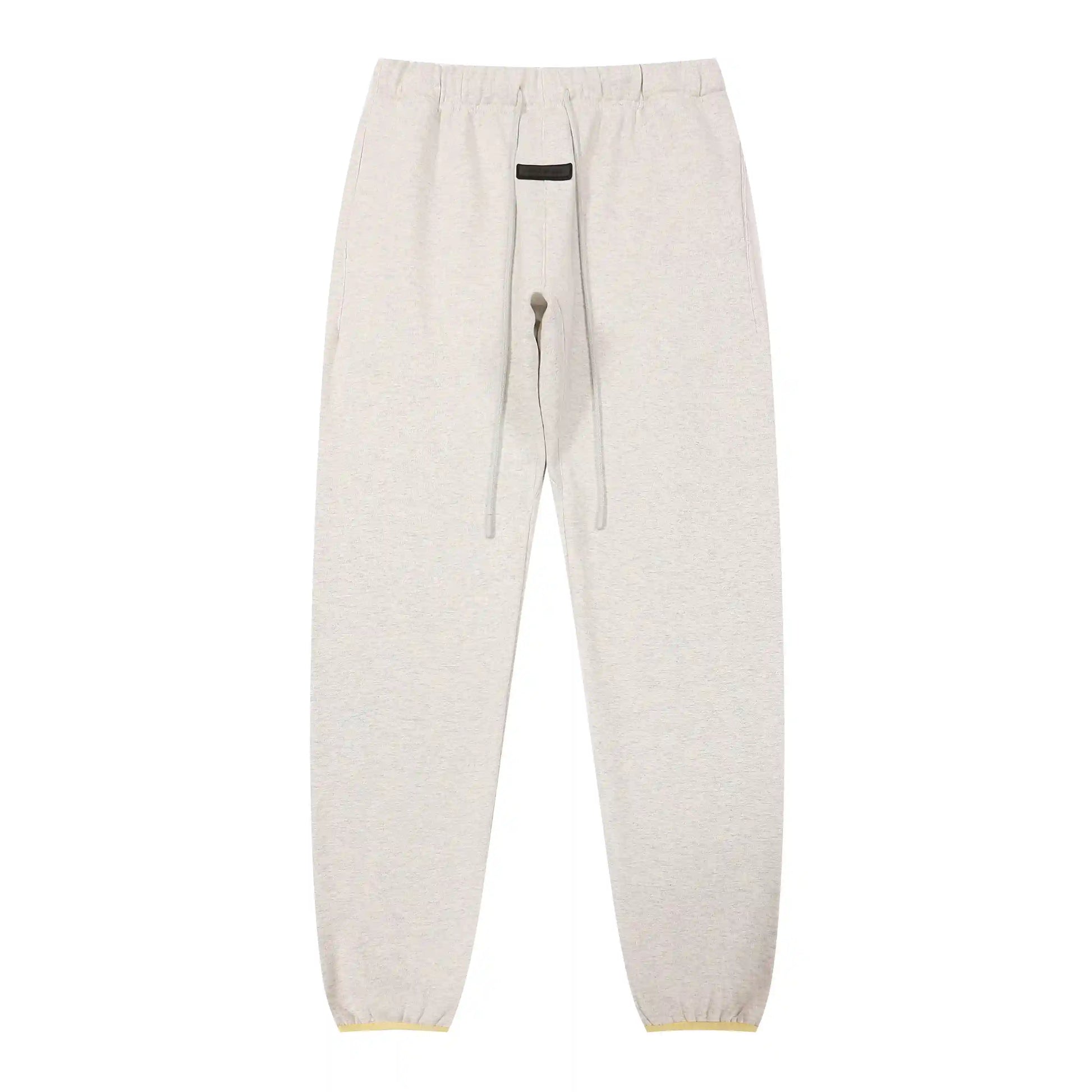 Cloud dance Essentials joggers soft-touch rubberized logo on leg close-up