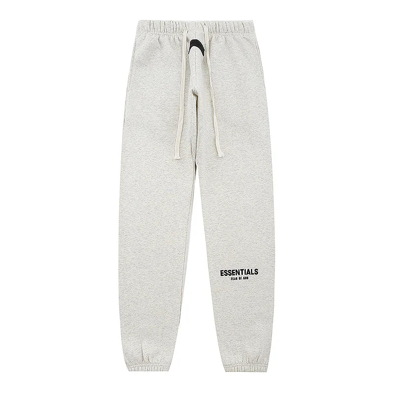 Back view of Essentials light heather oatmeal everyday fleece tracksuit by Fear Of God