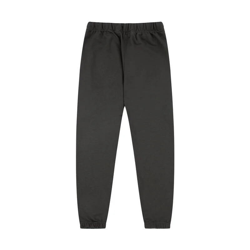Essentials rubberized label detail on black tracksuit (hood or front label)